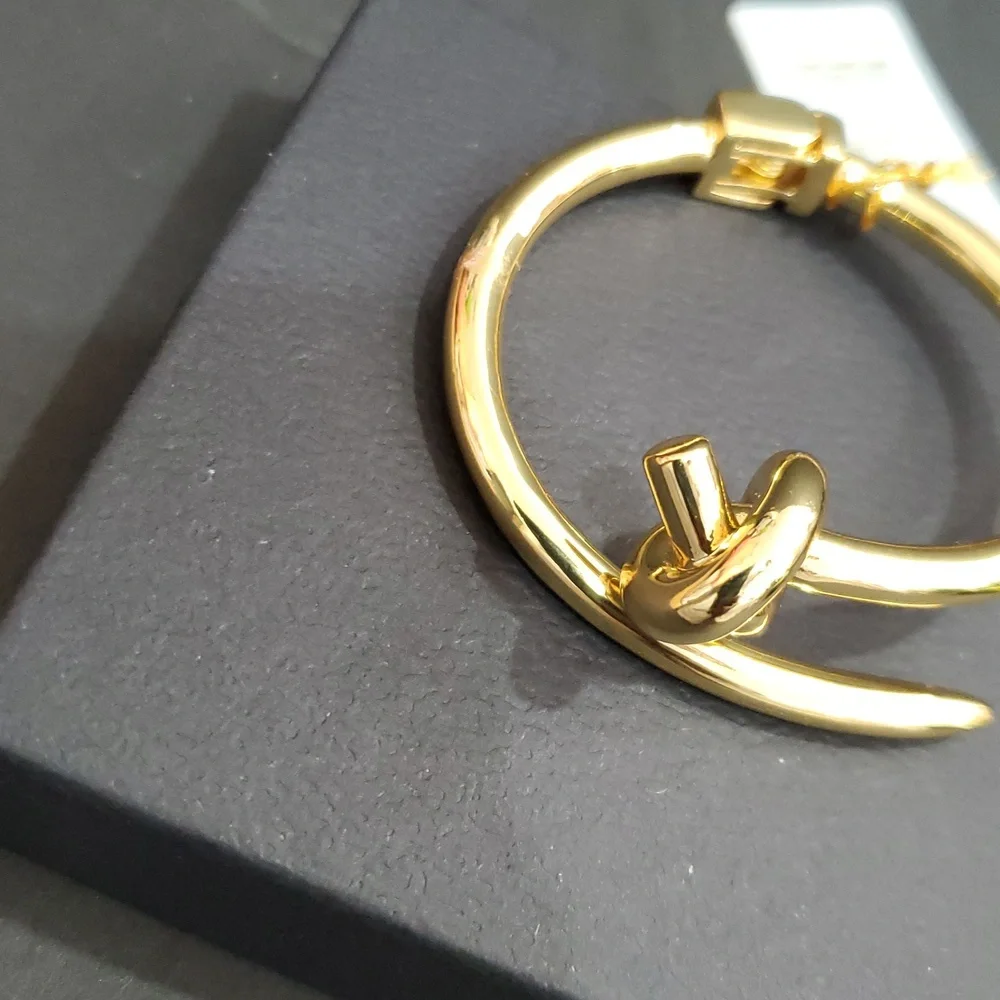 Eye Candy gold tone knot and point open‎ cuff hinged bracelet bangle brand new